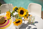 Sunflowers on poolside patio table