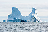 Majestic iceberg formation on blue