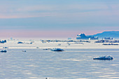 Polar ice melting on tranquil Atlantic Ocean Greenland