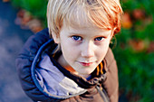 Portrait boy with blond hair and blue eyes