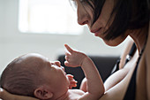 Close up mother holding newborn baby son
