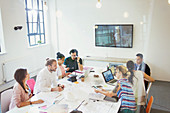 Architects working in conference room meeting