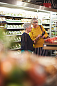 Senior women shopping in supermarket