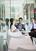 Business people laughing in cafe