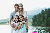 Smiling family at lakeside