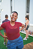 Portrait confident carefree young woman