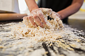 Close up woman kneading dough
