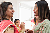 Indian women in saris talking