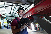 Portrait confident, smiling male mechanic