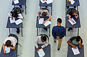 Teacher supervising students taking exam