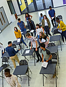 View from above students finishing exam