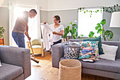 Mature couple folding laundry