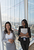 Businesswoman at highrise office window