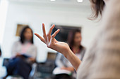 Close up businesswoman gesturing in meeting