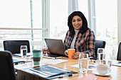 Businesswoman using laptop