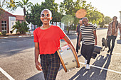 Portrait Musicians carrying instruments on road