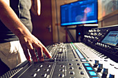 Male producer at music sound board