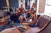 Musicians with laptop and guitar