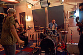 Musicians practicing in recording studio