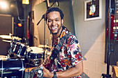 Portrait Male musician playing guitar