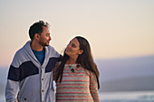 Happy affectionate couple hugging on beach