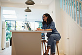 Woman working from home at laptop