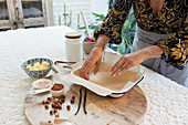 Woman baking at kitchen table