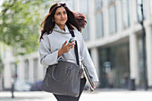 Woman walking with smart phone
