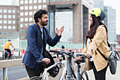 Business people with bicycles talking