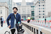 Portrait businessman with bicycle and coffee