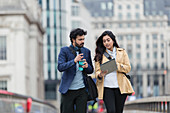 Business people with digital tablet and coffee