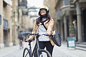 Portrait woman in helmet with bicycle