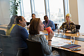 Businesswoman drinking coffee meeting