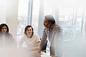 Businessman leading conference room meeting