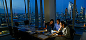 Business people at laptop, London, UK