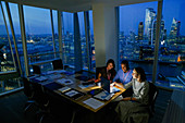 Business people in highrise office, London, UK