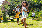 Family playing and blowing bubbles