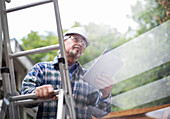 Senior male construction foreman using tablet