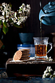 Pouring tea and Stroopwafel cookies