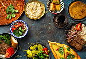 Traditional Turkish dishes and mezze - Pide, Lahmacun, meat kebab, Turkish meatballs, sweet baklava and Künefe
