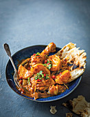 Malay-style chicken curry with naan bread