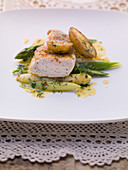 Chicken breast with asparagus and fried potatoes