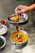 Prepating Malabar monkfish curry