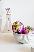 Ceramic bowl with ripe eggplants