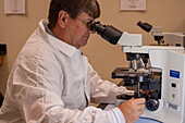 Laboratorian Using Microscope