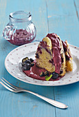 Lemon cream puff with blueberries and blueberry sauce