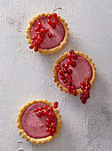 Raspberry cakes decorated with currants