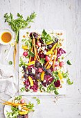 Beet, carrot and feta with orange and hazelnuts