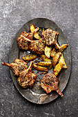 Baked lamb chops with roasted potatoes