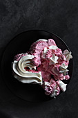 Crushed heart-shaped meringue cake